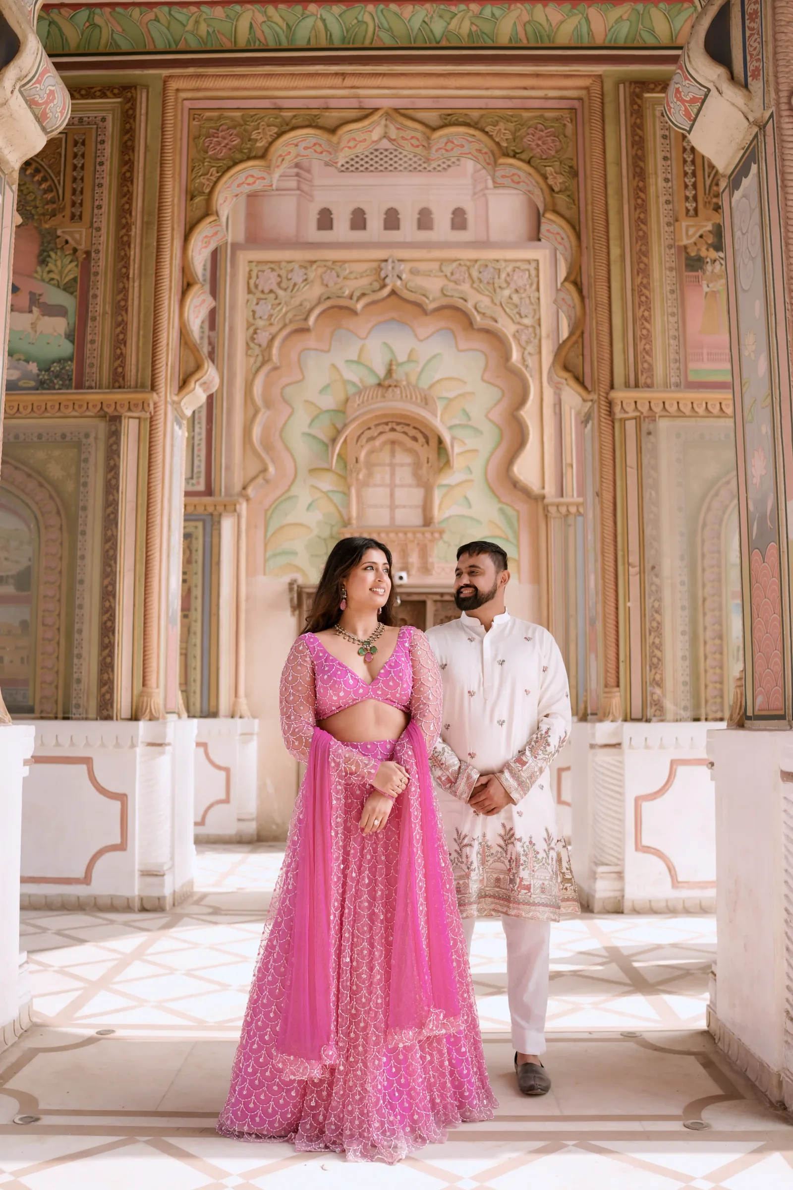 Linisha and Amit at a palace courtyard